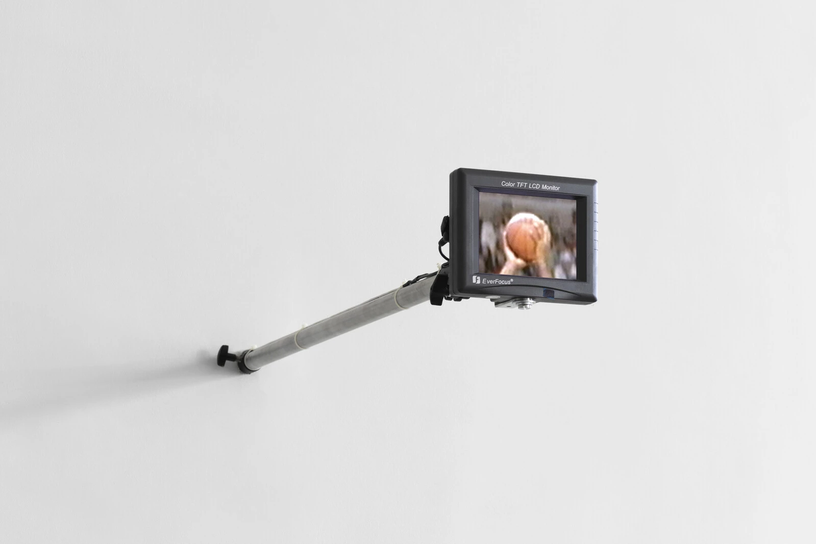 Paul Pfeiffer, <em>John 3:16</em>, 2000. Standard-definition video (color, silent), 5.6-inch LCD monitor, and metal armature; 6 × 7 × 36 in. (15.2 × 17.8 × 91.4 cm); 2 minutes, 7 seconds. The Museum of Modern Art, New York. Gift of David Teiger. © Paul Pfeiffer. Courtesy of the artist; Paula Cooper Gallery, New York; carlier | gebauer, Berlin/Madrid; Perrotin; and Thomas Dane Gallery, London. Photo: Steven Probert. 2025/01/PPF_002.jpg 