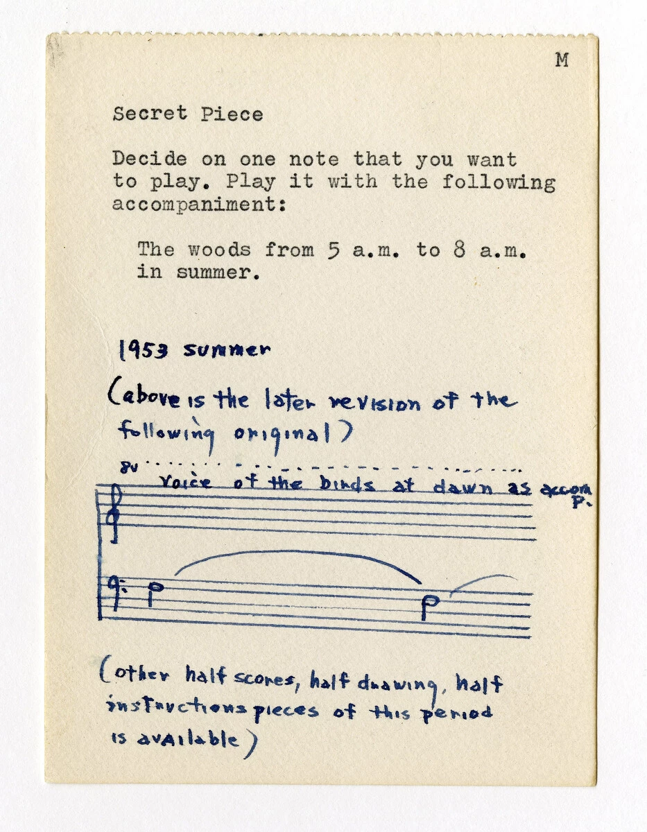 Typewritten piece of paper titled Secret Piece with a handwritten score on the bottom half